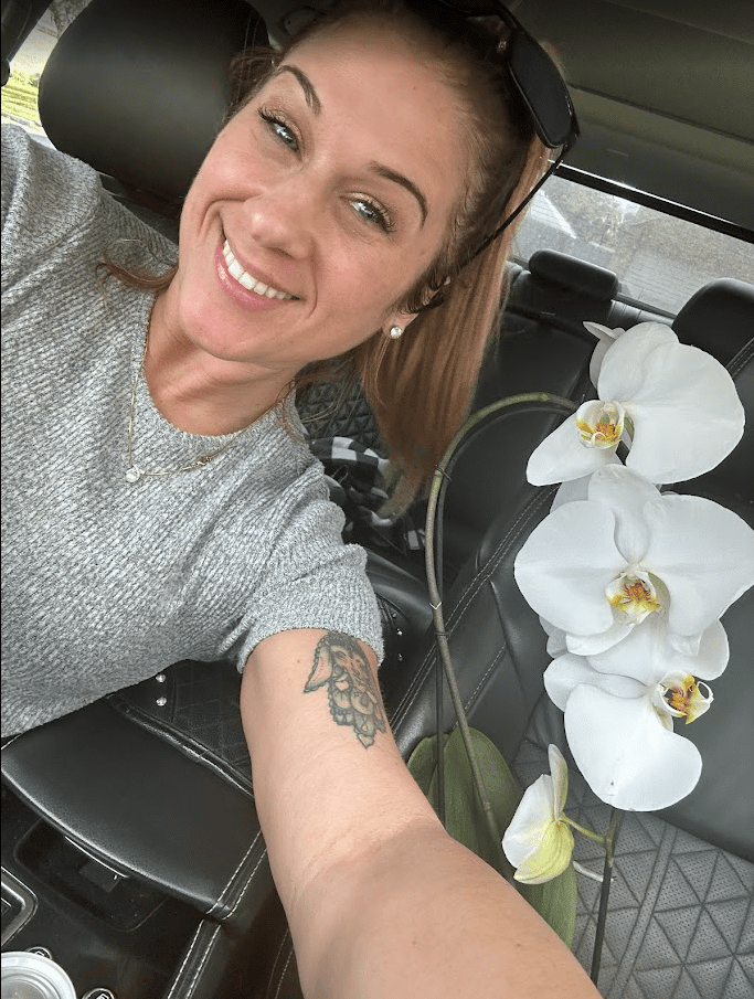 Heather-Curley-with-Orchid-in-car
